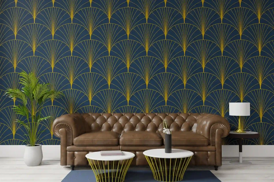 Art-deco fan pattern wallpaper in deep blue and gold behind a sofa